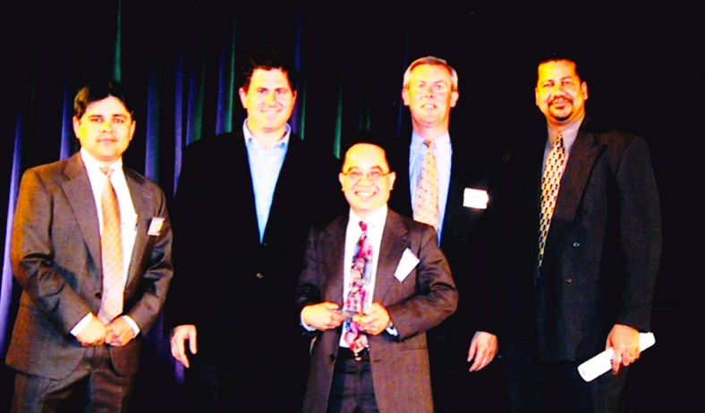 Tommy Hodinh received MBE of the Diverse of the Year Award from the Founder and CEO Michael Dell (Middle) and Fred Montoya Vice President of Supply Chain (Left)